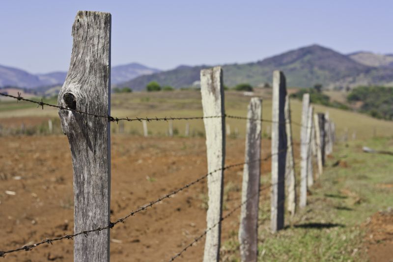 Commercial Barbed Wire Fence Installation
