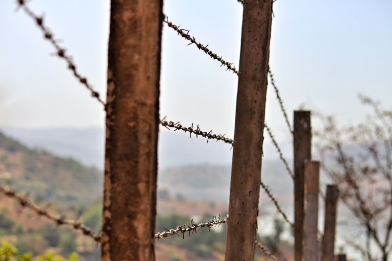 Commercial Barbed Wire Fence Installation