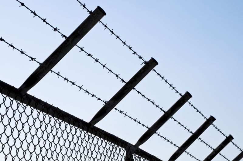 Commercial Barbed Wire Fence Installation