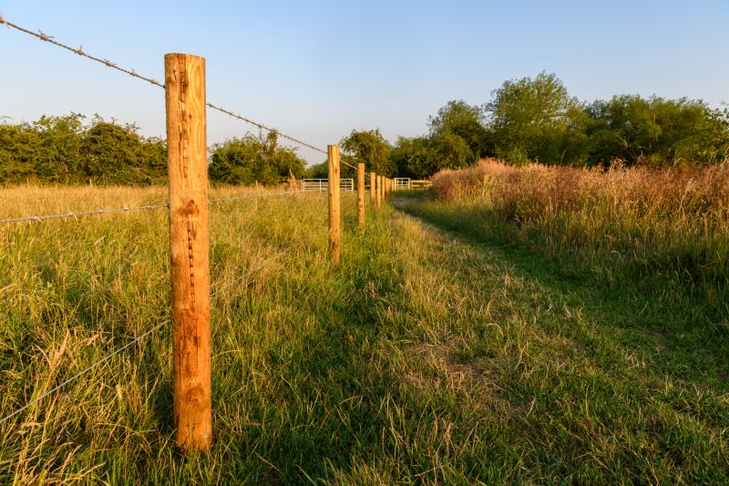 Commercial Barbed Wire Fence Installation