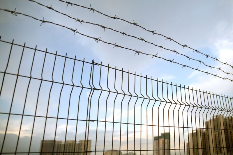 Commercial Barbed Wire Fence Installation