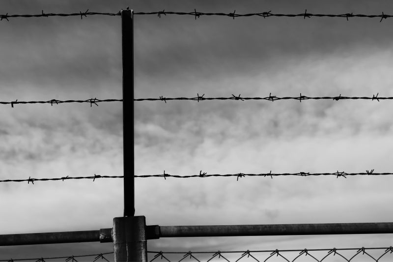 Commercial Barbed Wire Fence Installation