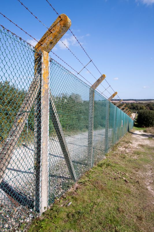Commercial Barbed Wire Fence Installation
