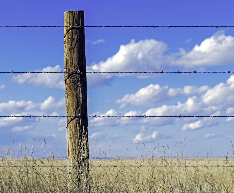 Commercial Barbed Wire Fence Installation