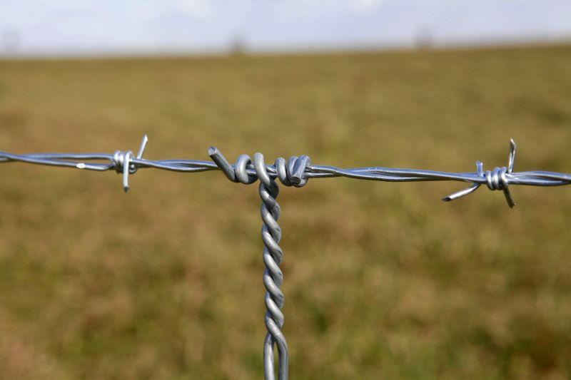 Commercial Barbed Wire Fence Repair